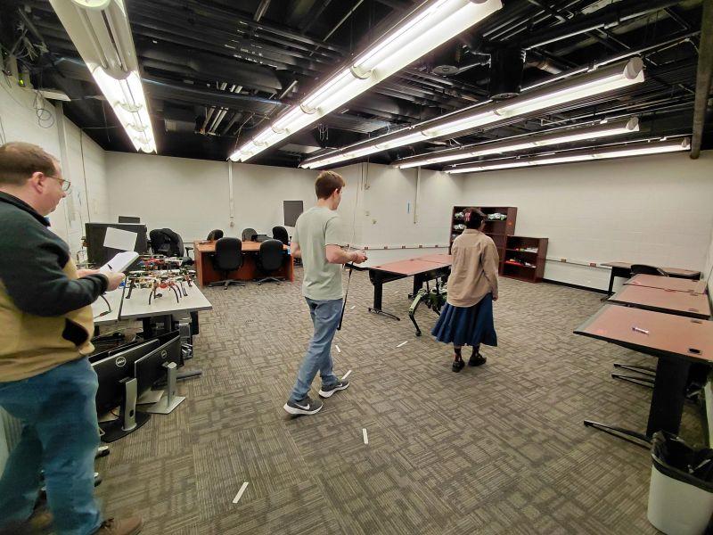 Operator guiding the robot along the lab route
