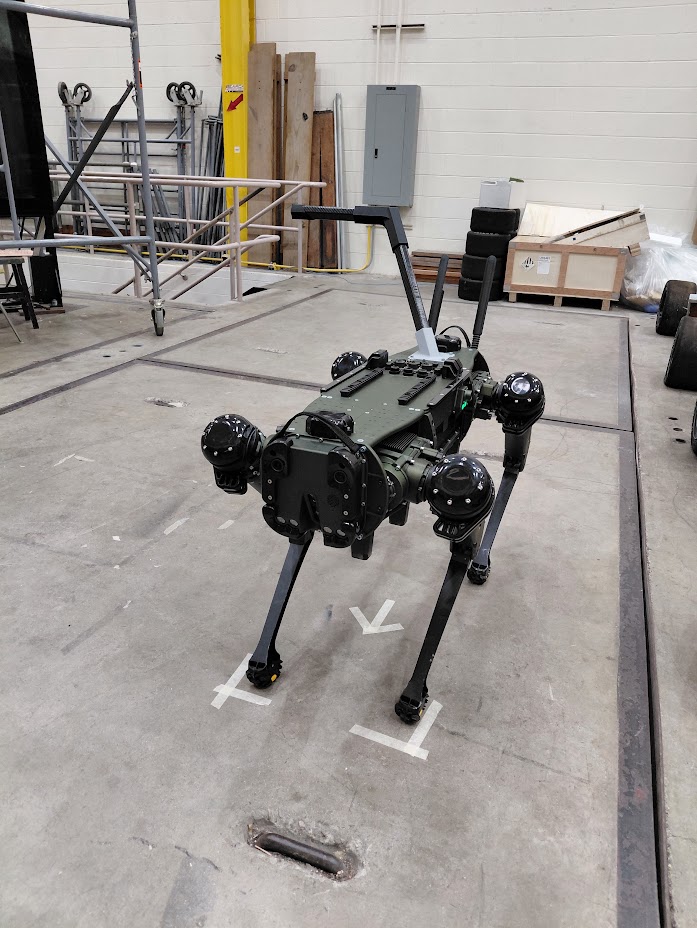 Quadruped robot with guidance handle