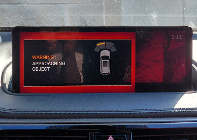 Acura MDX central display showing a red Approaching Object proximity warning