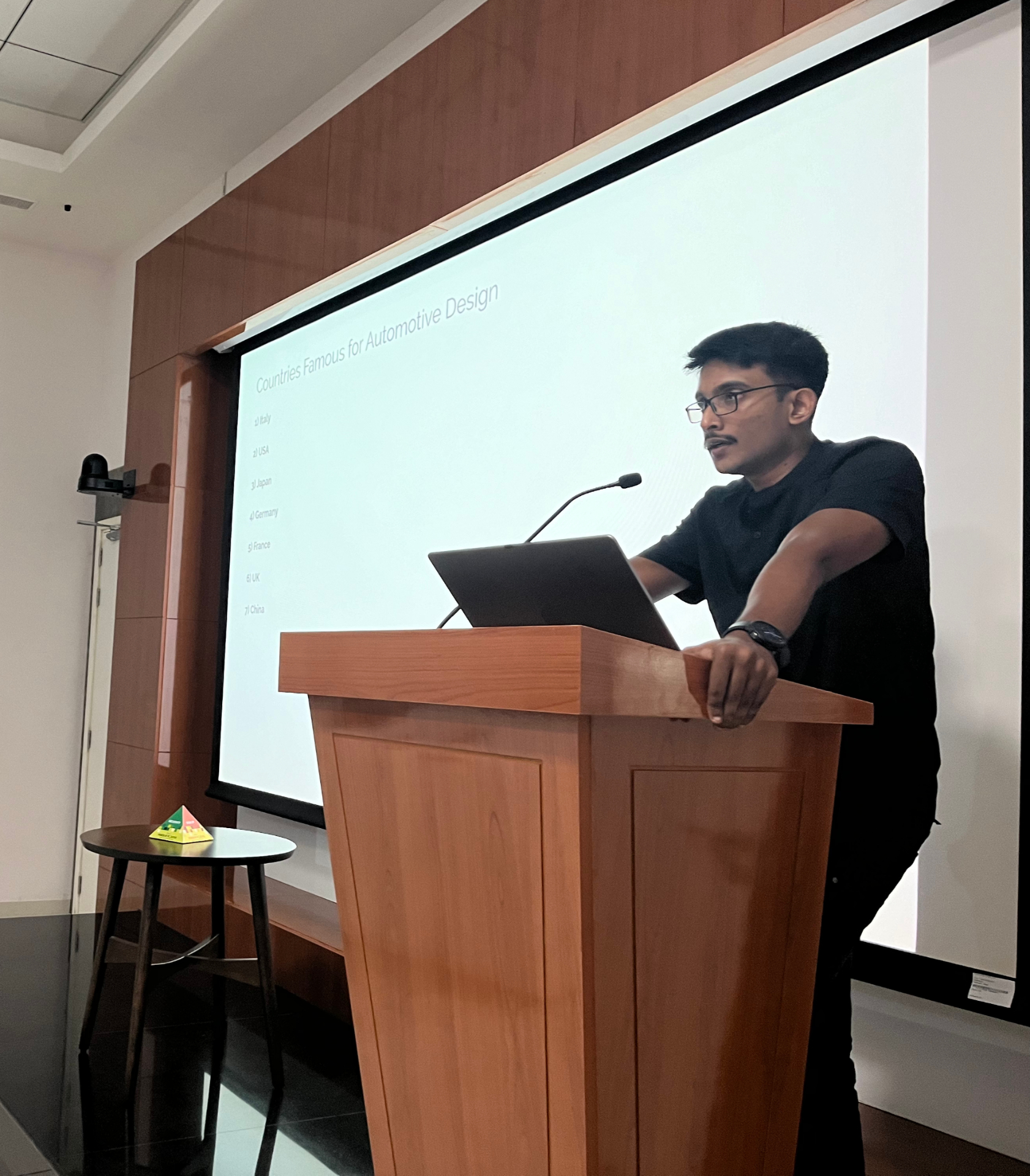 Prize giving a talk on automotive design